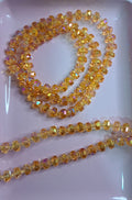 CRISTAL RONDELL FACETADO CON MOSTACILLA | NARANJA TRASLUCIDO TORNASOL | 5.1MM